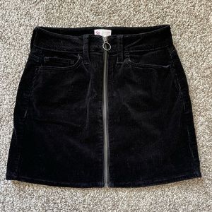 So corduroy black zip front skirt